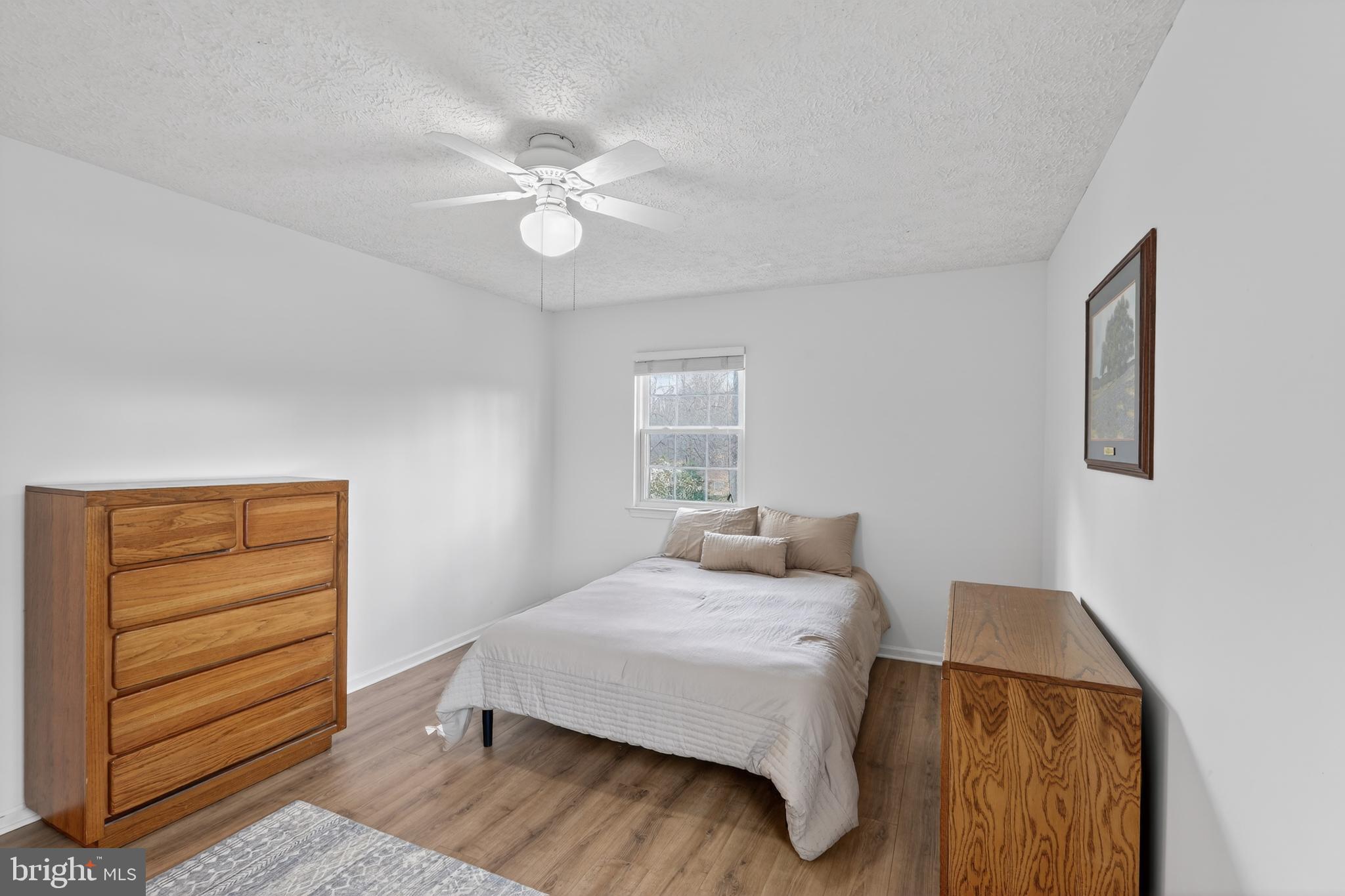 7200 Beachway Court Springfield, VA 22153 - Photo 18 of 31 a bedroom with a bed and cabinet