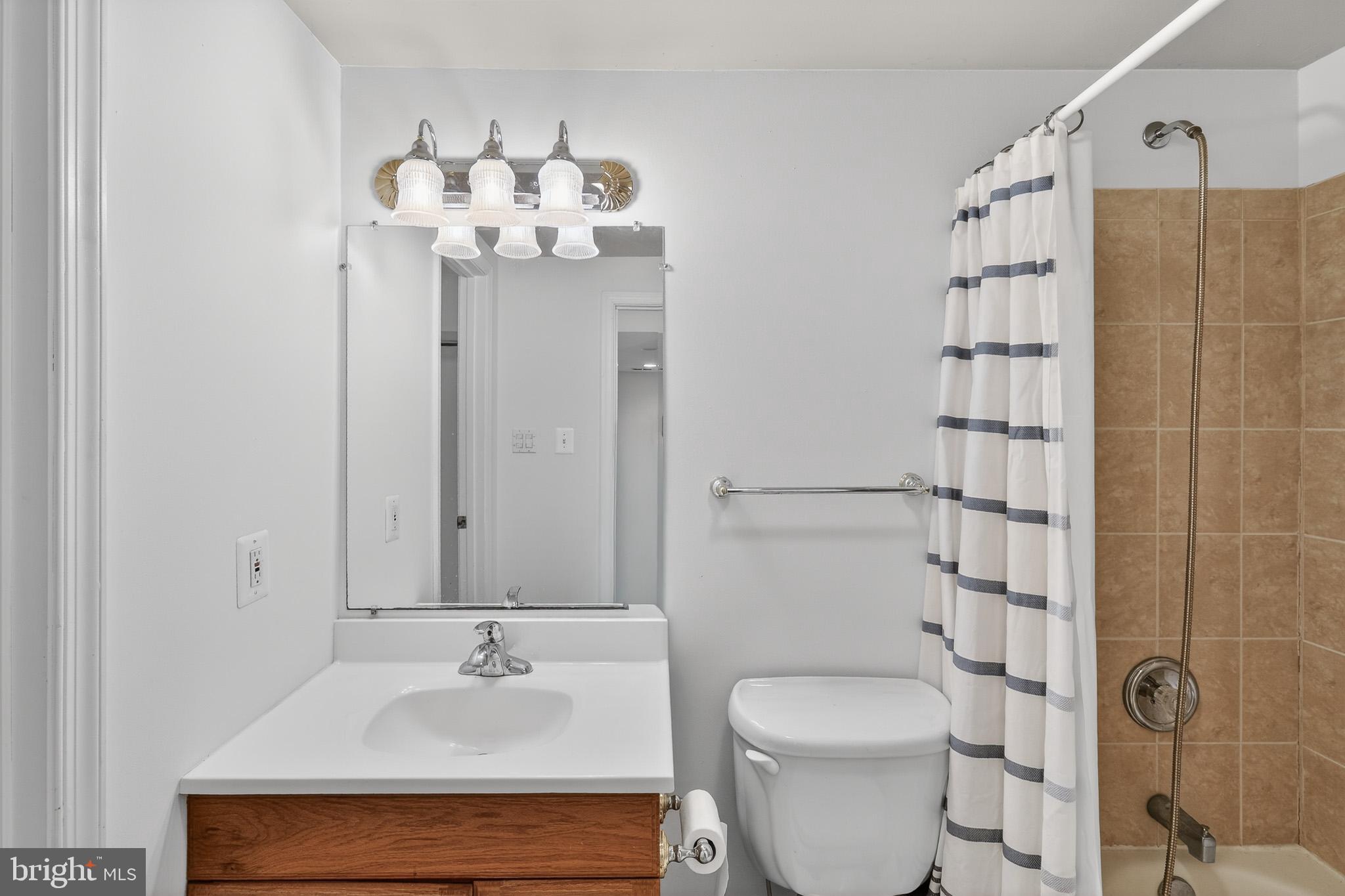 7200 Beachway Court Springfield, VA 22153 - Photo 23 of 31 a bathroom with a sink toilet and shower