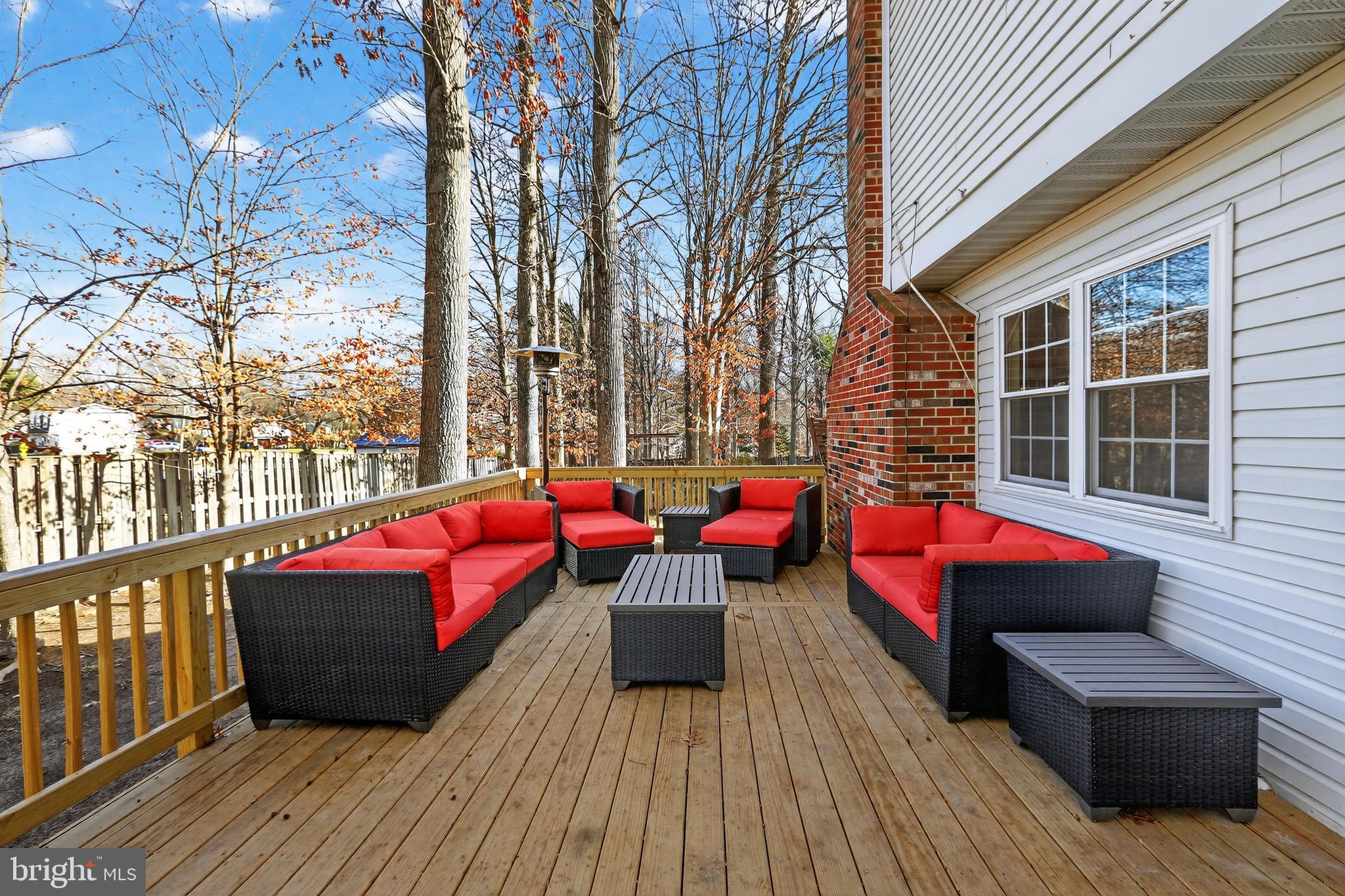 7200 Beachway Court Springfield, VA 22153 - Photo 25 of 31 a balcony with wooden floor table and chairs