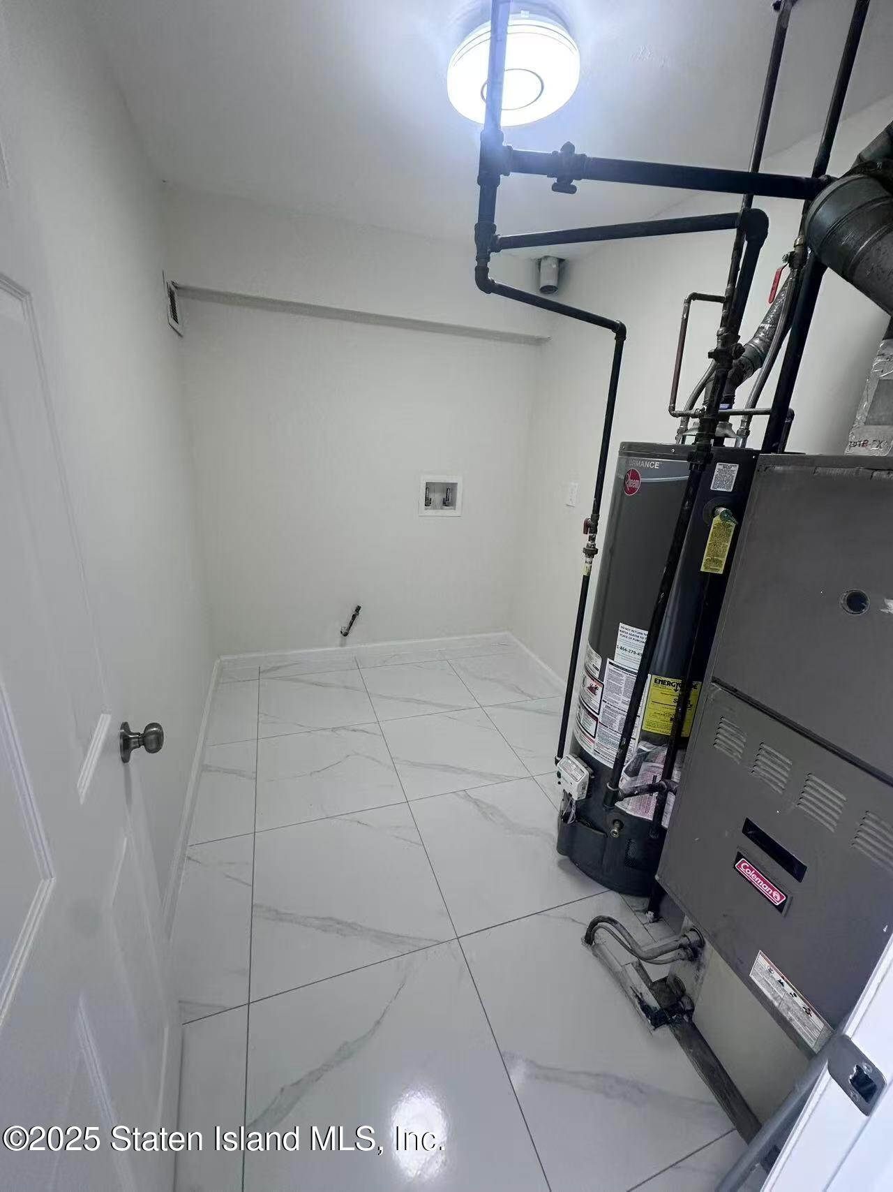 19 Drumgoole Road East Staten Island, NY 10312 - Photo 11 of 13 a view of a room with gym equipment