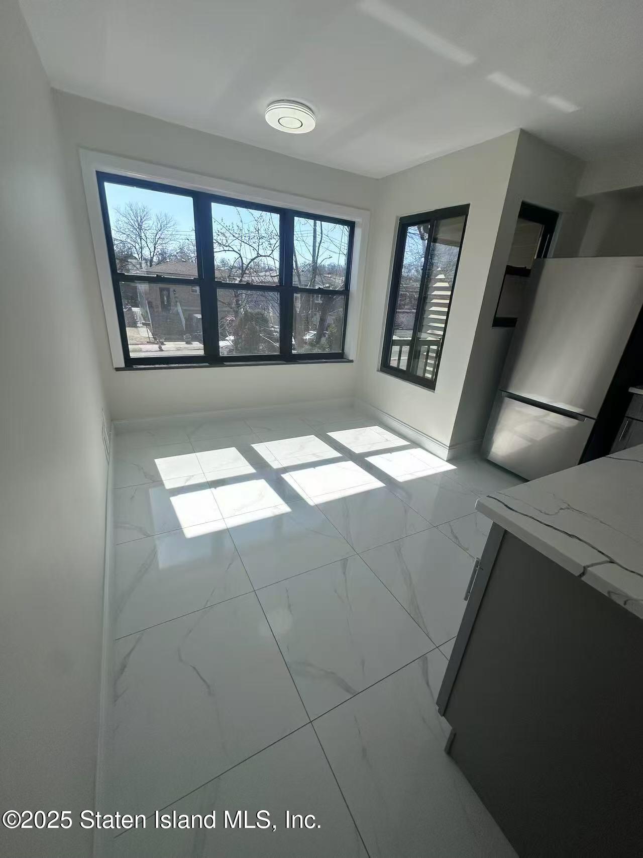 19 Drumgoole Road East Staten Island, NY 10312 - Photo 12 of 13 a view of an empty room with a window