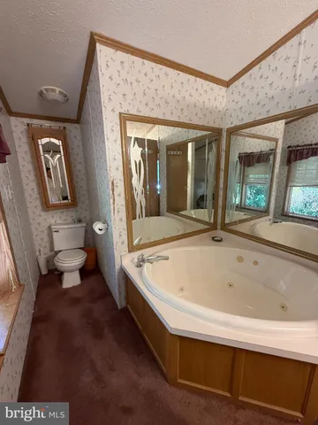 a spacious bathroom with a tub and shower