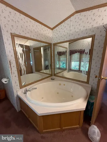 a white bath tub sitting in a bathroom