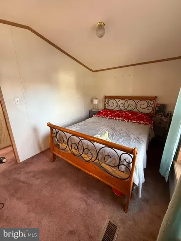 a view of a room with bed