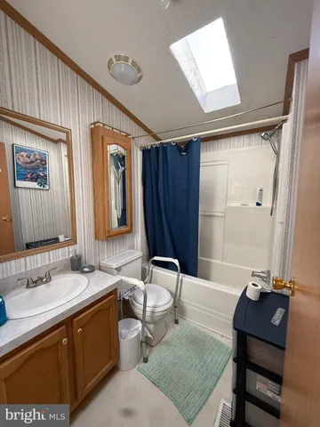 a bathroom with a sink double vanity and a mirror