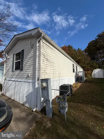 a view of backyard with outdoor seating