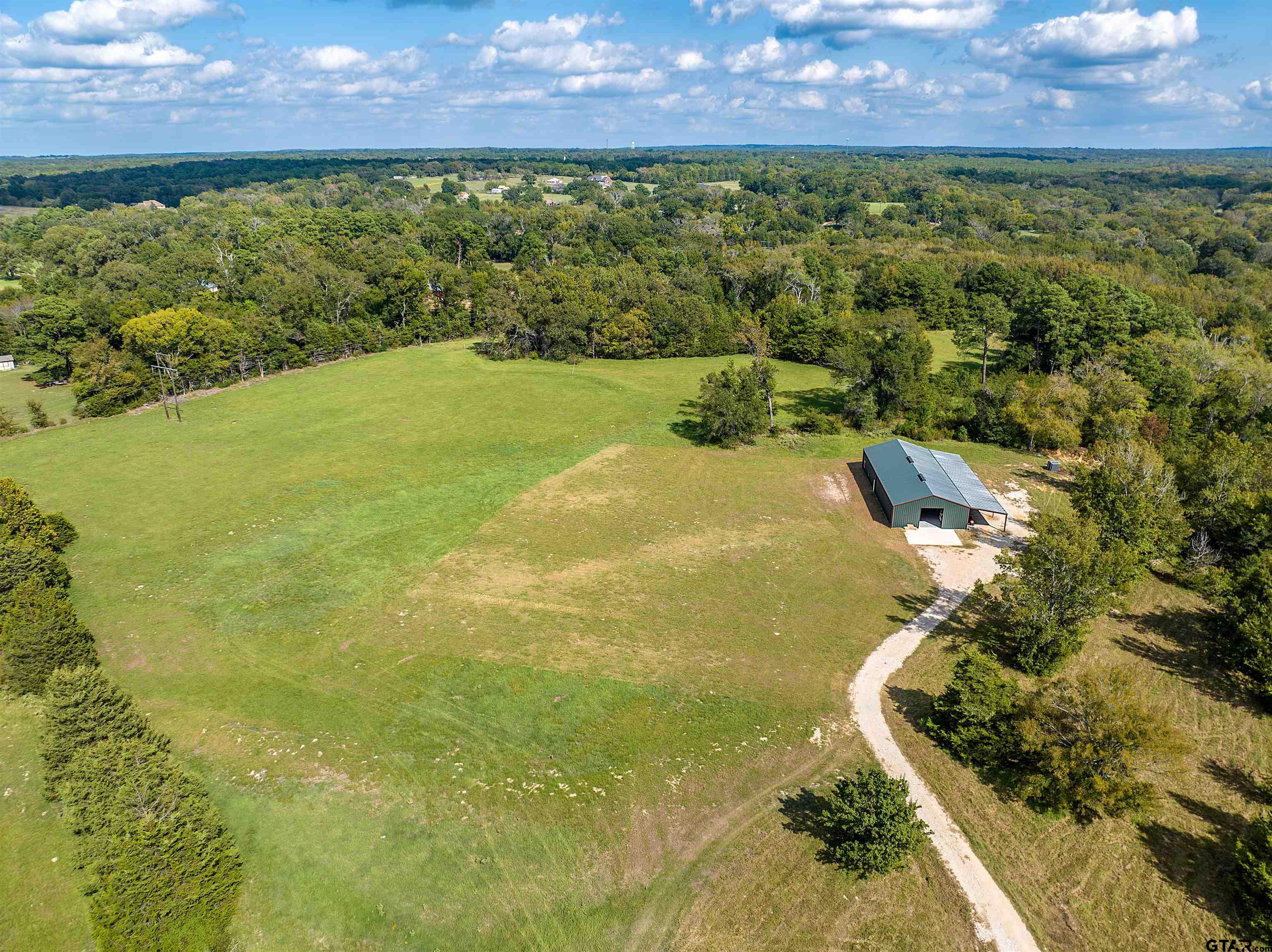 a view of a yard with an ocean