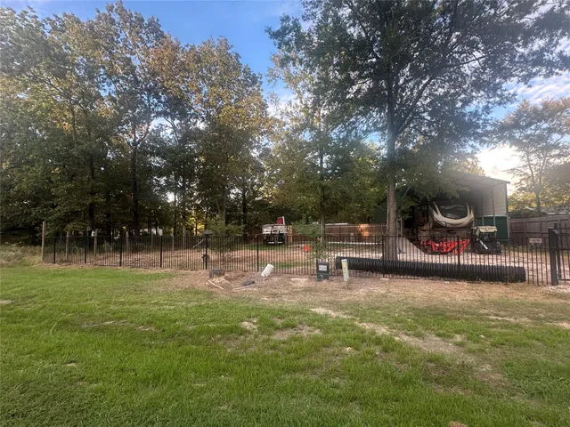a view of backyard and entertaining space