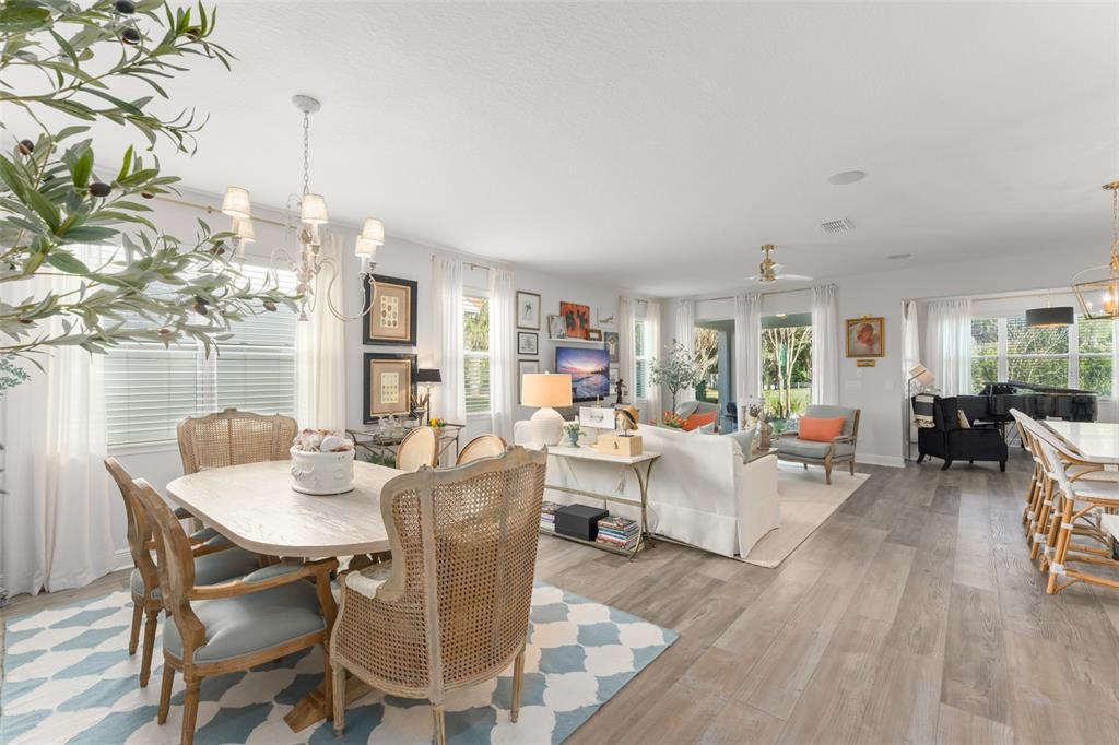 2983 Rapollo Lane Apopka, FL 32712 - Photo 14 of 62 a view of a dining room with furniture window and wooden floor