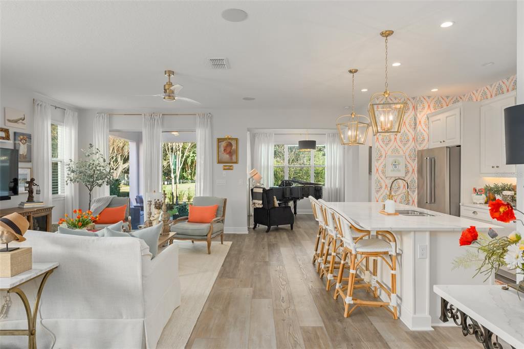 2983 Rapollo Lane Apopka, FL 32712 - Photo 18 of 62 a living room with furniture and a chandelier