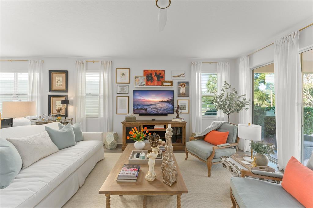 2983 Rapollo Lane Apopka, FL 32712 - Photo 20 of 62 a living room with furniture and a flat screen tv