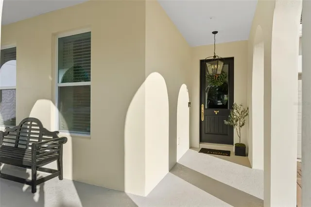 a view of a bedroom with a furniture and window