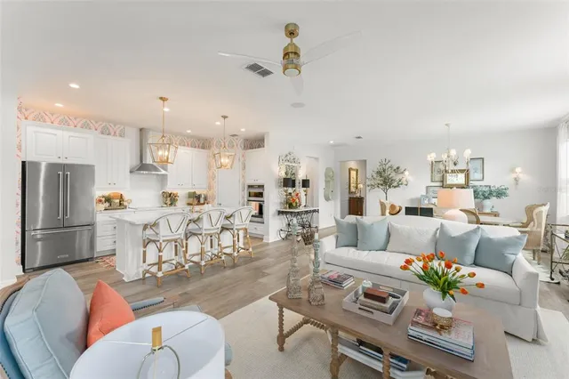 a kitchen with stainless steel appliances a sink and refrigerator