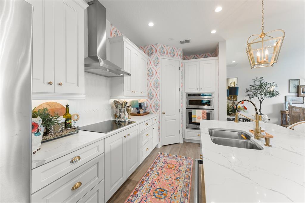 2983 Rapollo Lane Apopka, FL 32712 - Photo 27 of 62 a kitchen with white cabinets and sink