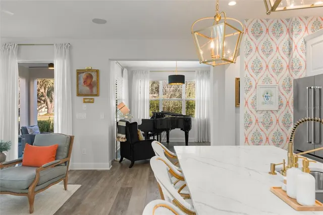 a spacious bathroom with a granite countertop sink mirror and shower