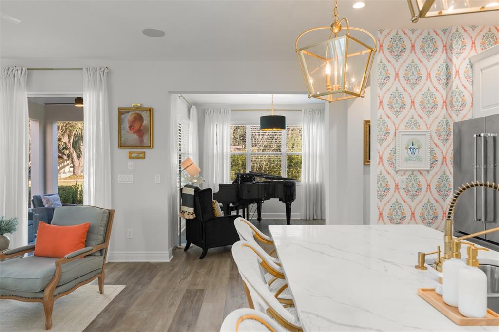 2983 Rapollo Lane Apopka, FL 32712 - Photo 33 of 62 a living room with fireplace furniture and a chandelier