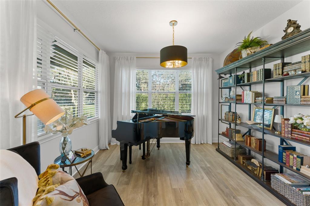 2983 Rapollo Lane Apopka, FL 32712 - Photo 34 of 62 a living room with furniture and a large window