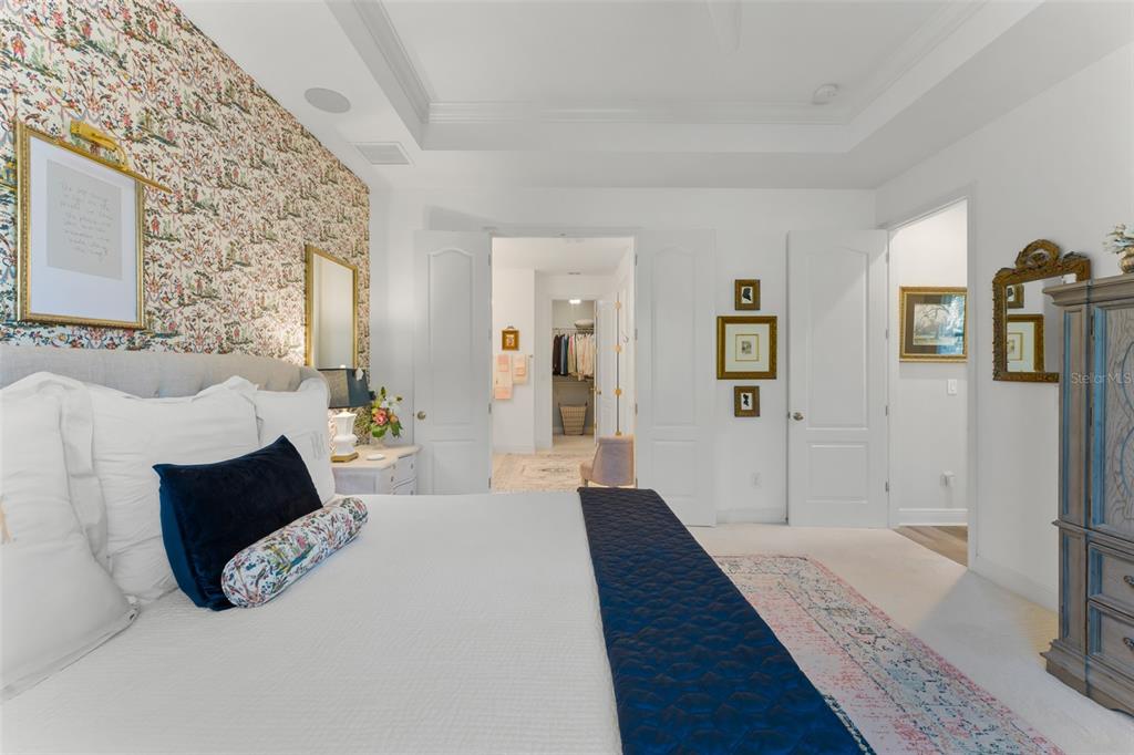 2983 Rapollo Lane Apopka, FL 32712 - Photo 38 of 62 a spacious bedroom with a bed and a couch