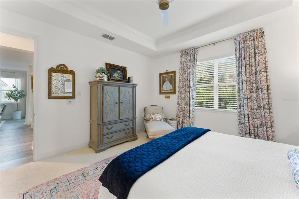 2983 Rapollo Lane Apopka, FL 32712 - Photo 39 of 62 a bedroom with a bed and a dresser