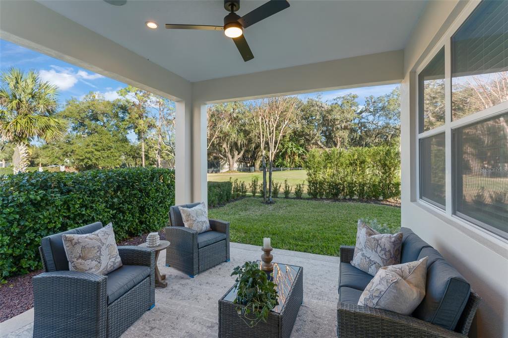 2983 Rapollo Lane Apopka, FL 32712 - Photo 44 of 62 a outdoor living space with furniture and garden view