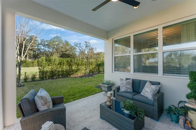 an aerial view of a house with a swimming pool yard and outdoor seating