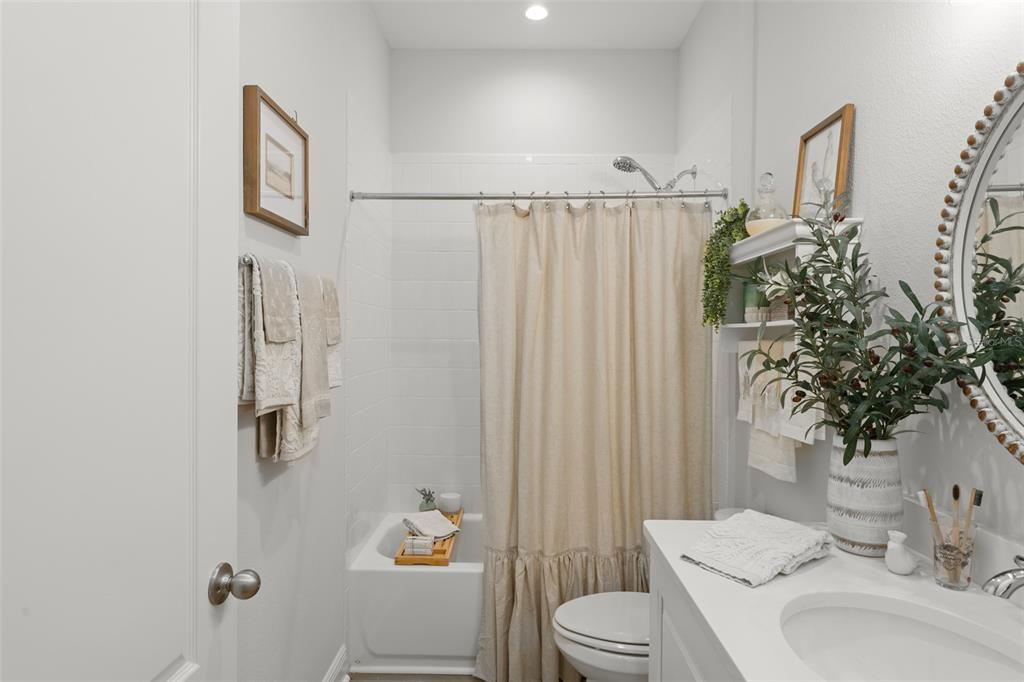 2983 Rapollo Lane Apopka, FL 32712 - Photo 5 of 62 a bathroom with a sink toilet and shower