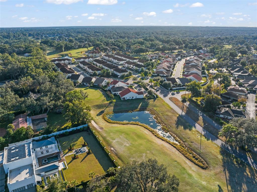 2983 Rapollo Lane Apopka, FL 32712 - Photo 56 of 62 an aerial view of residential houses with outdoor space and swimming pool