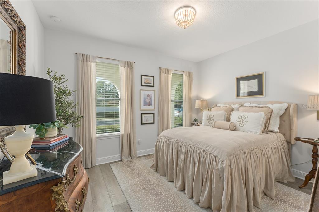 2983 Rapollo Lane Apopka, FL 32712 - Photo 7 of 62 a bedroom with a bed and a flat screen tv