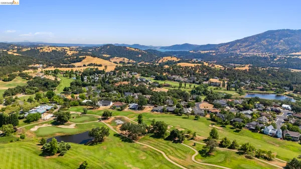 a view of a city with mountains in the background