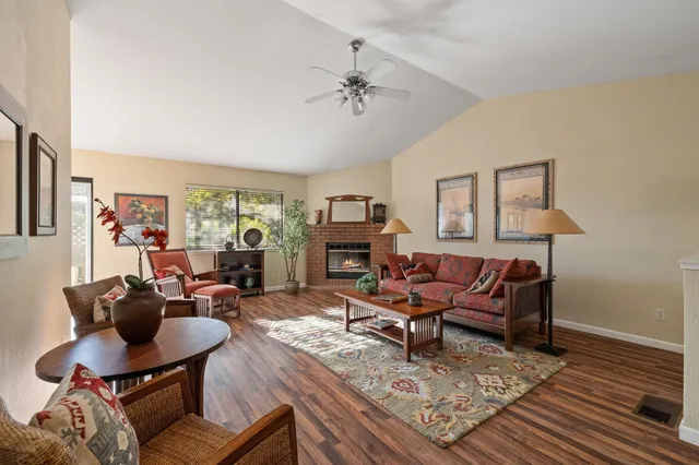 a living room with furniture and a fireplace