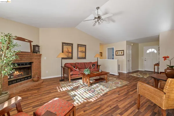 a room with furniture a flat screen tv and window