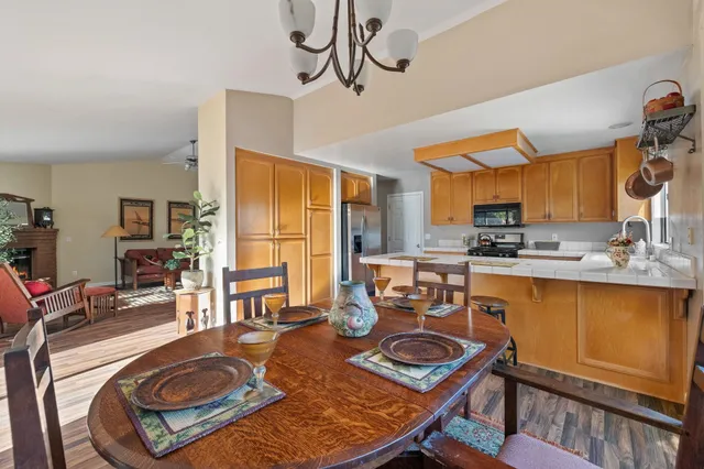 a kitchen with wooden cabinets and center island