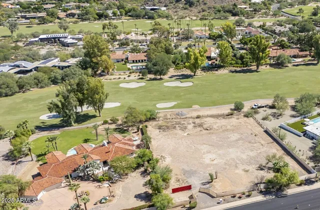 an aerial view of a houses with outdoor space
