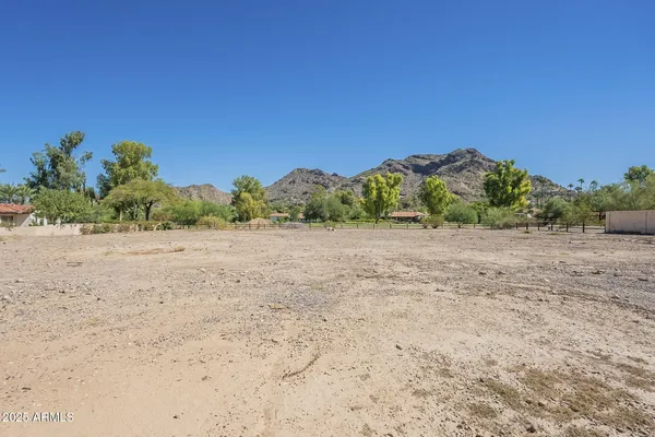 a view of a road with a building in the background