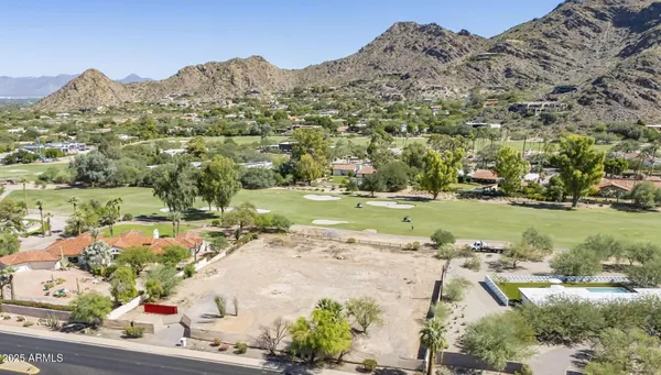an aerial view of a houses with outdoor space and street view