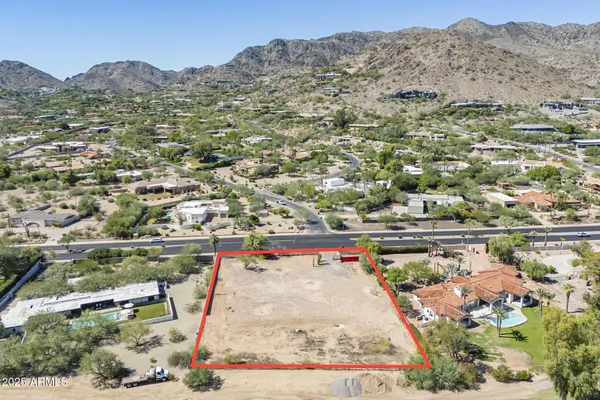 an aerial view of residential houses and outdoor space