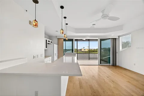 a view of a room with wooden floor