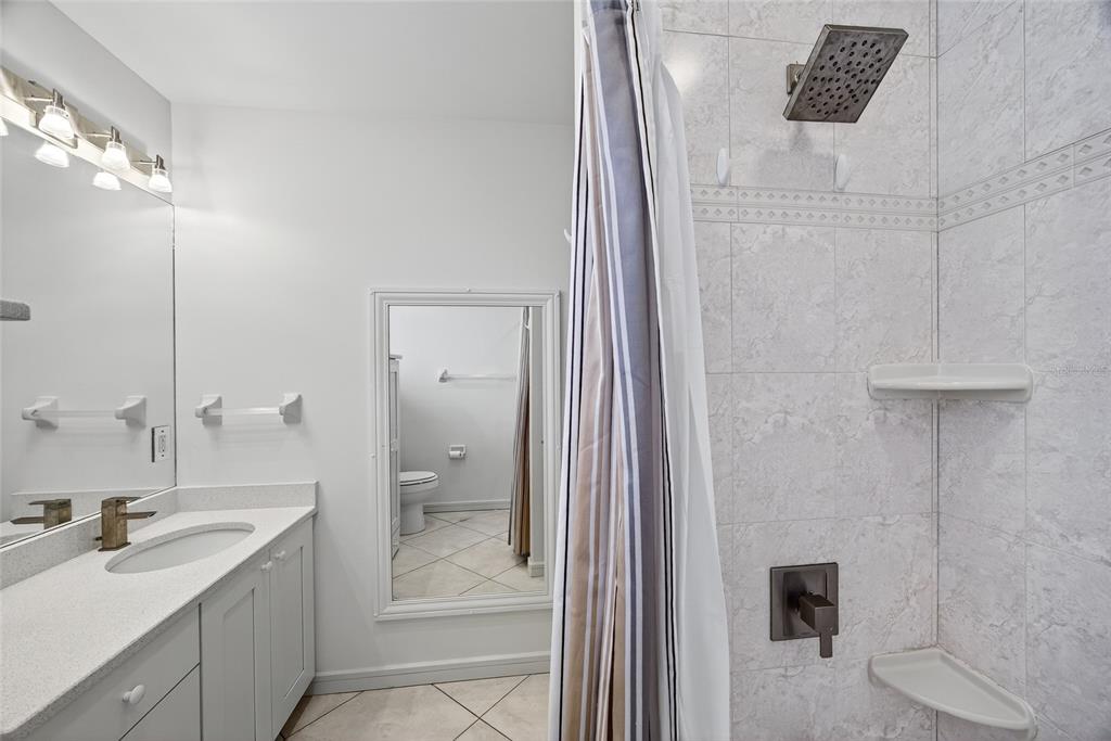 15435 Appleton Boulevard Port Charlotte, FL 33981 - Photo 31 of 49 a bathroom with a granite countertop sink a toilet and shower