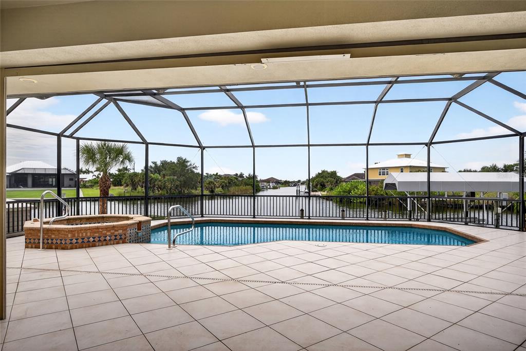 15435 Appleton Boulevard Port Charlotte, FL 33981 - Photo 34 of 51 a bedroom with furniture and large windows