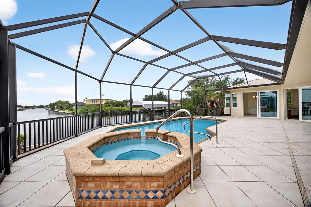 15435 Appleton Boulevard Port Charlotte, FL 33981 - Photo 38 of 49 a swimming pool with a outdoor seating