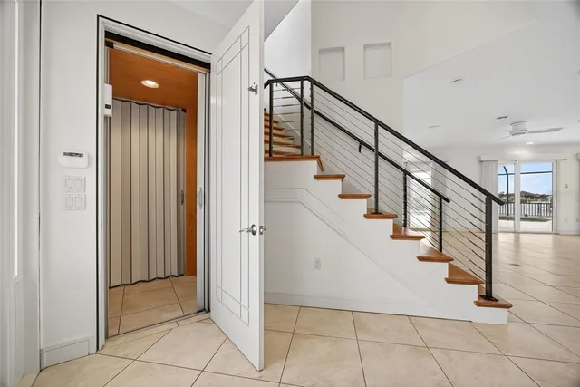 a view of entryway and hall with a front door