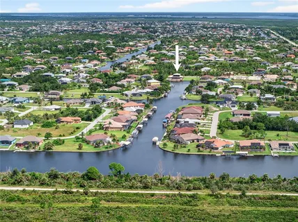 an aerial view of residential building and ocean