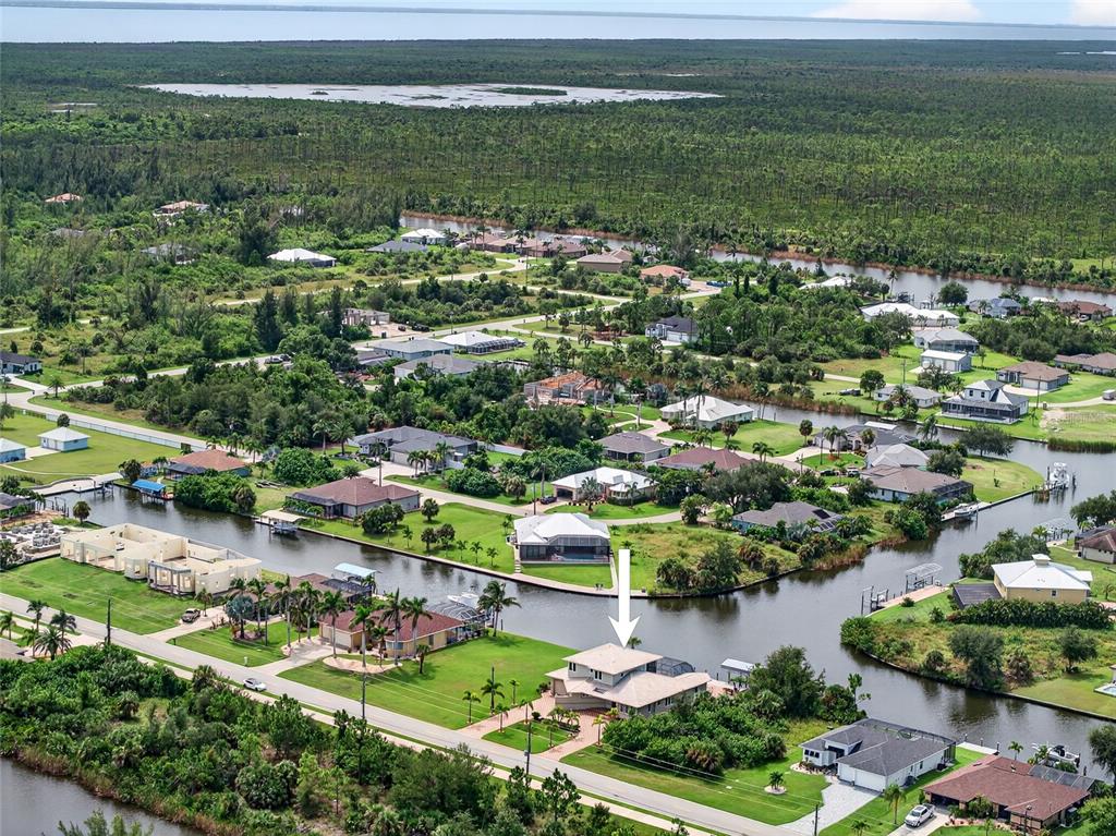 15435 Appleton Boulevard Port Charlotte, FL 33981 - Photo 47 of 49 an aerial view of residential houses with outdoor space and trees