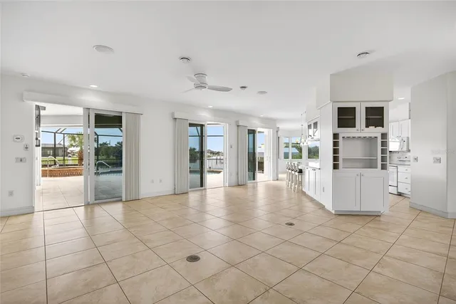 a view of kitchen with furniture and refrigerator