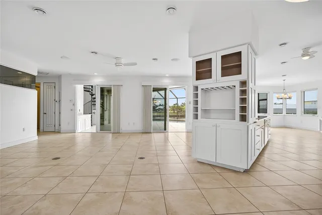 a view of a livingroom with kitchen appliances and furniture