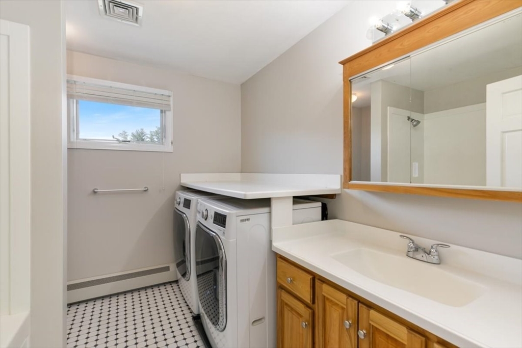 270 Salem Road Dracut, MA 01826 - Photo 17 of 42 a bathroom with a sink and a mirror