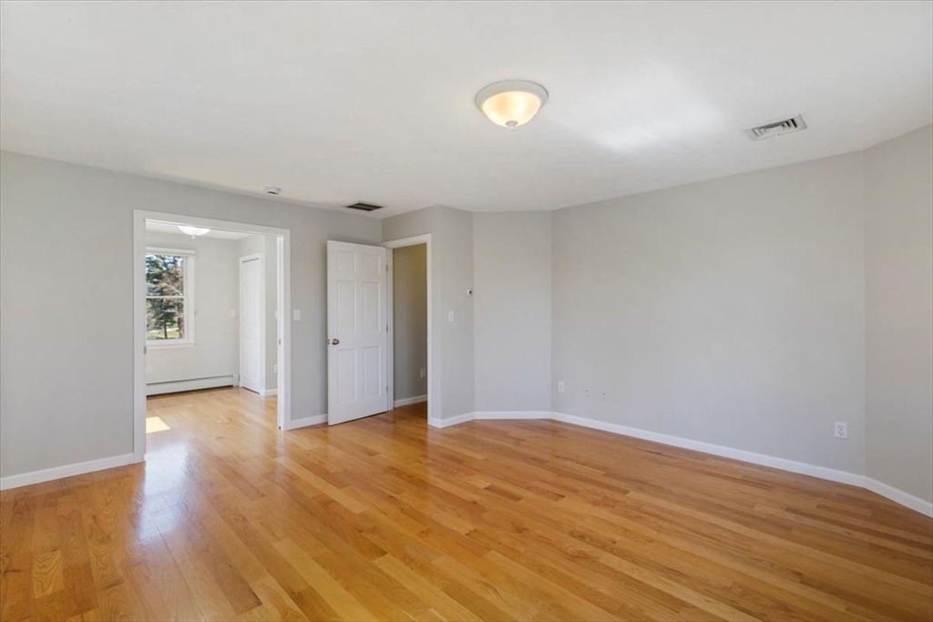 270 Salem Road Dracut, MA 01826 - Photo 20 of 42 a view of an empty room with wooden floor