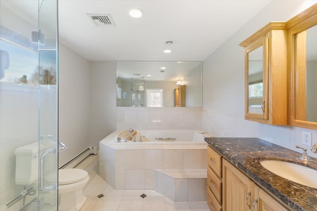 270 Salem Road Dracut, MA 01826 - Photo 22 of 42 a bathroom with a granite countertop sink mirror vanity bathtub and toilet