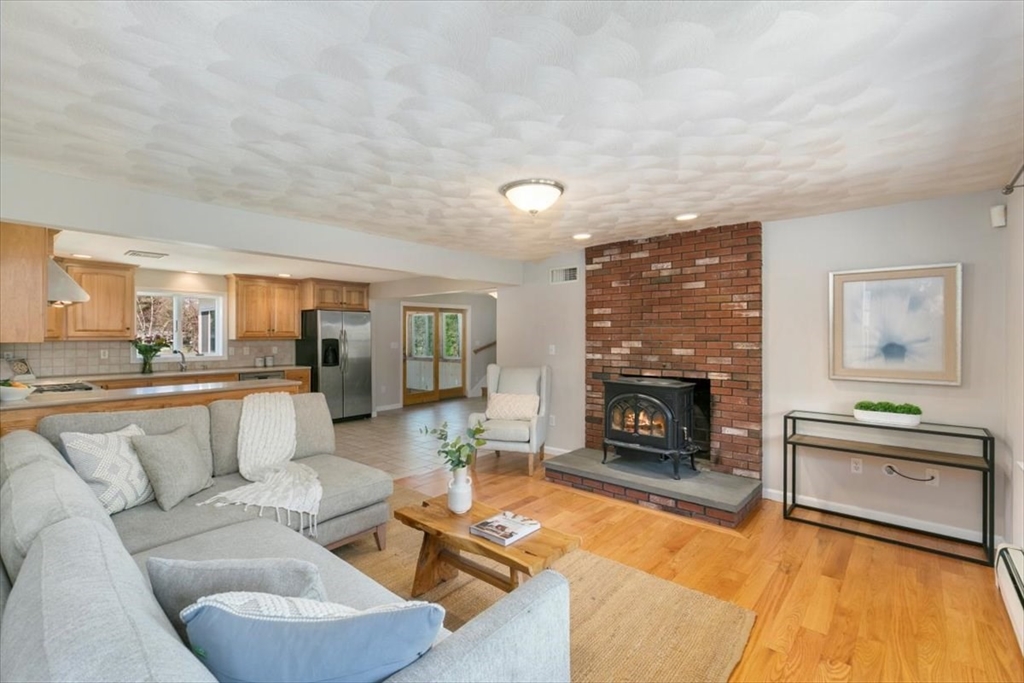 270 Salem Road Dracut, MA 01826 - Photo 3 of 42 a living room with furniture and a fireplace
