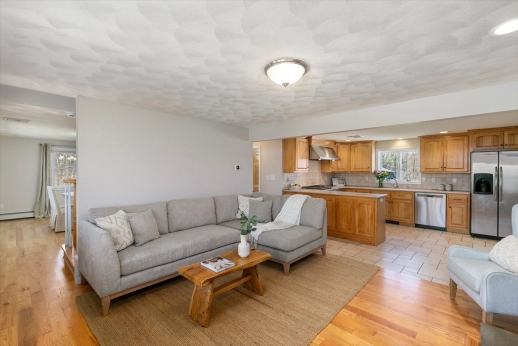 270 Salem Road Dracut, MA 01826 - Photo 4 of 42 a living room with furniture and view of kitchen